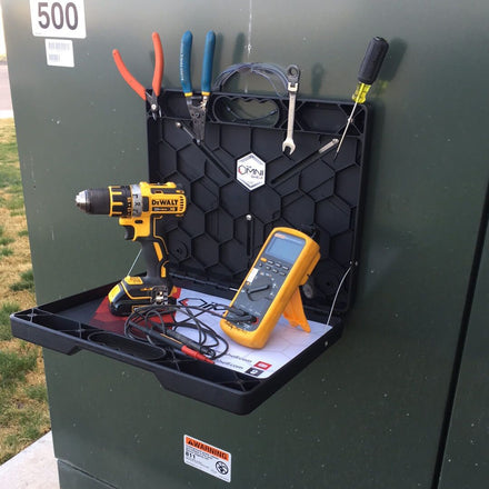 OmniShelf workstation holding tools, documents, and accessories